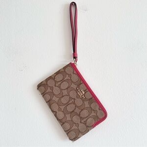 Coach corner zip signature logo jacquard red trim wristlet